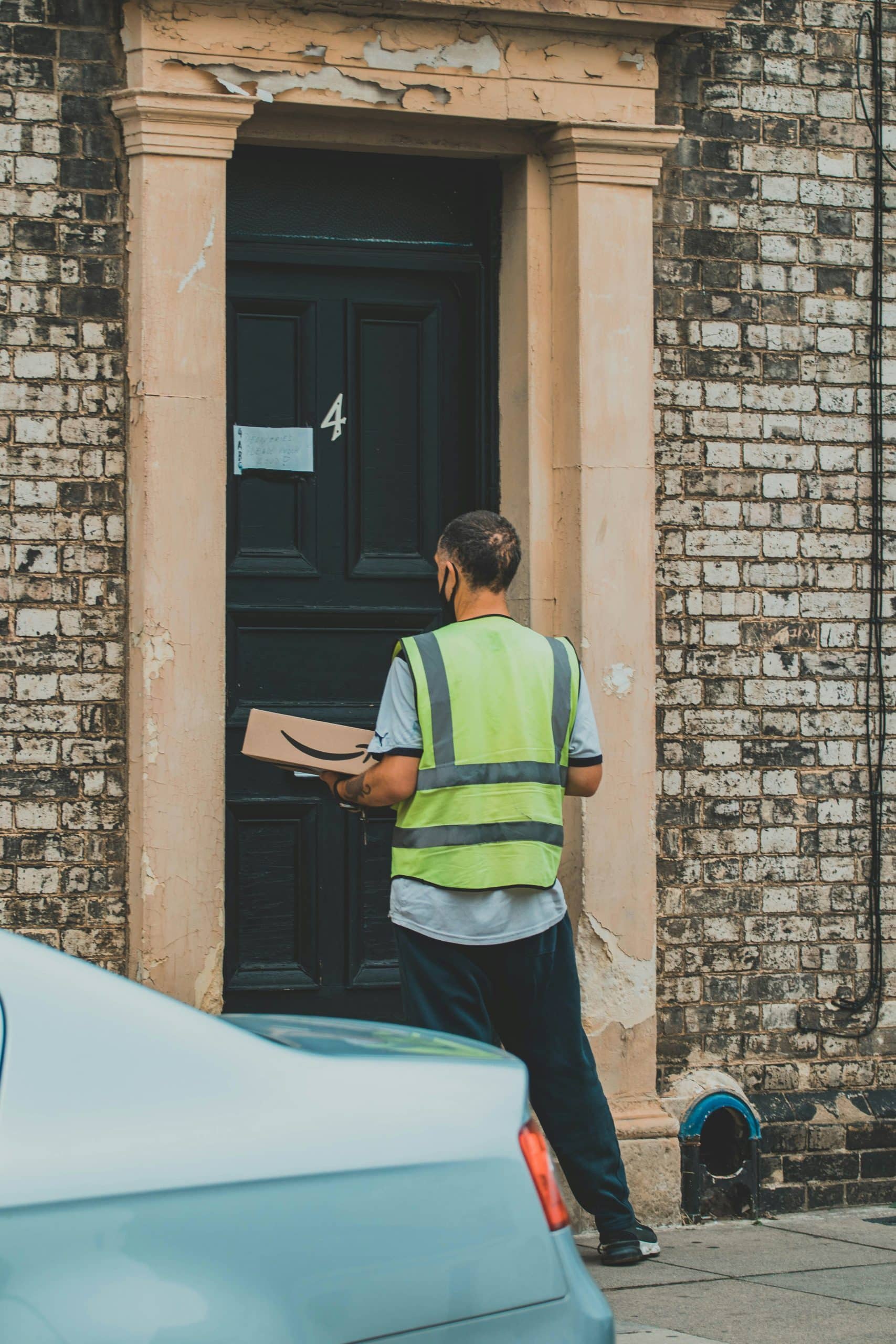 Website design for modern businesses. A man delivering an ecommerce parcel