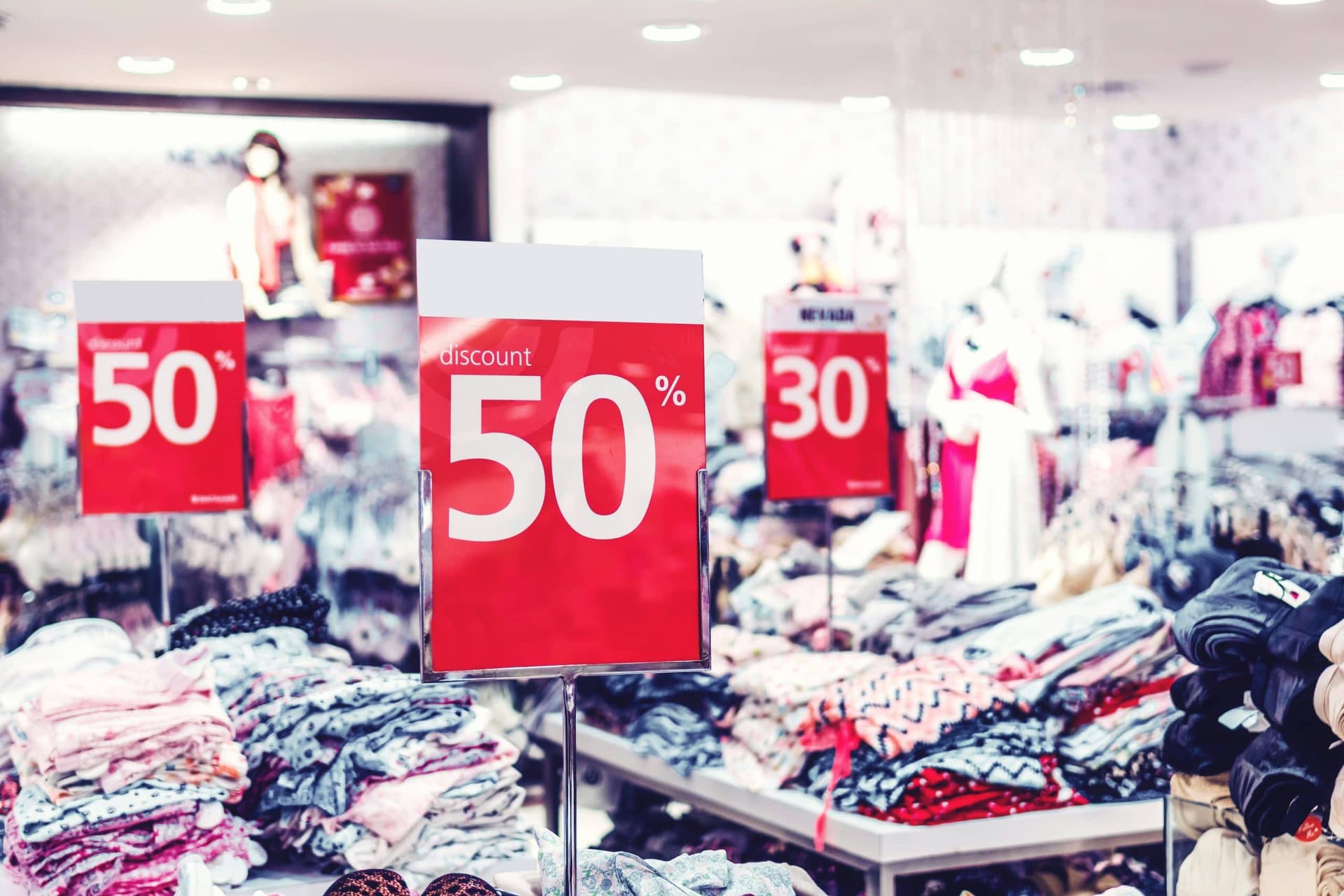 Fifty percent discount sign on a retail storefront