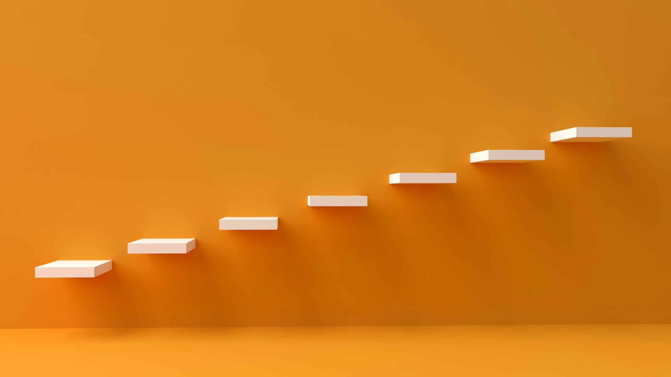 yellow wall with white steps going up from left to right