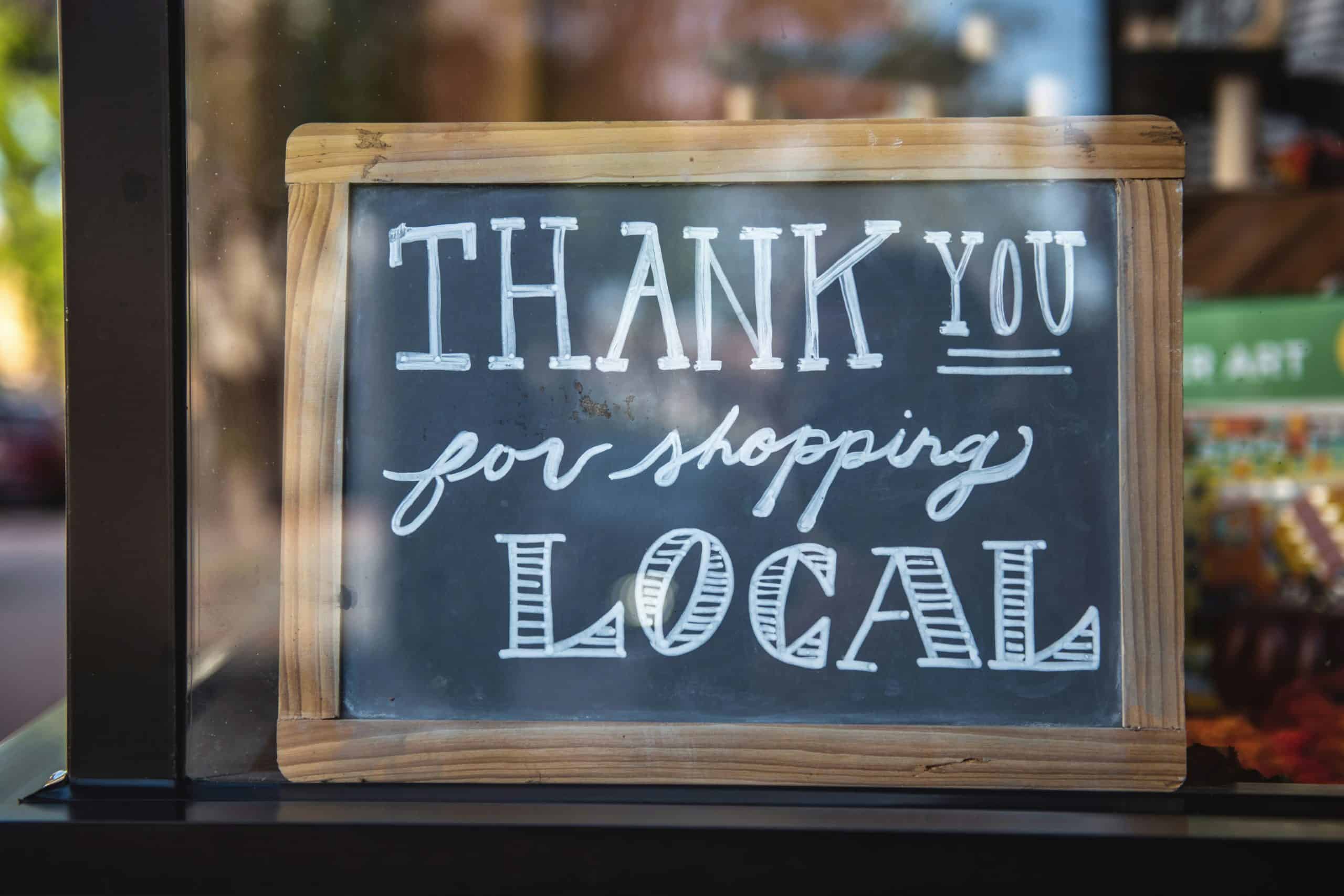 Chalk board with message about shopping local SEO